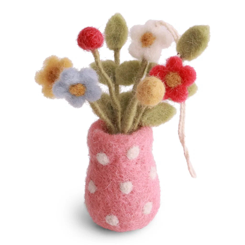 Vase rose à pois avec des fleurs