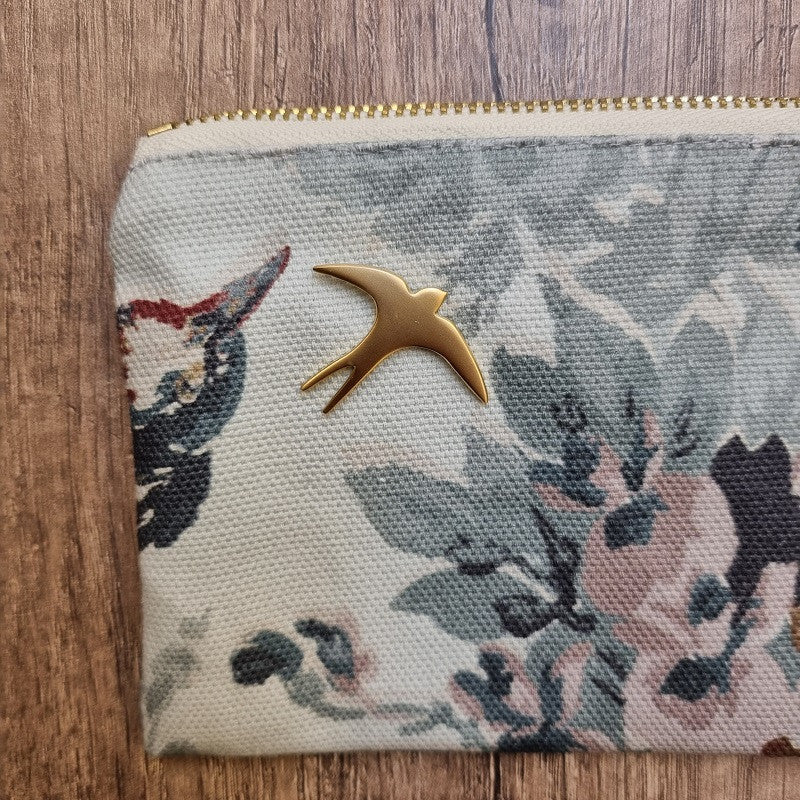 Pin's hirondelle doré